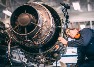 Man working on an airplane.
