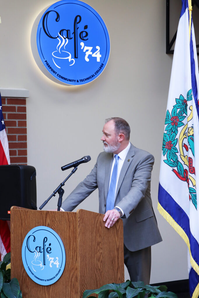 David Beighley, Interim Provost and Vice President of Academic Affairs at Pierpont Community & Technical College, addresses attendees at the Café ’74 ribbon cutting, highlighting the café’s role in connecting classroom instruction with hands‑on, real‑world learning.