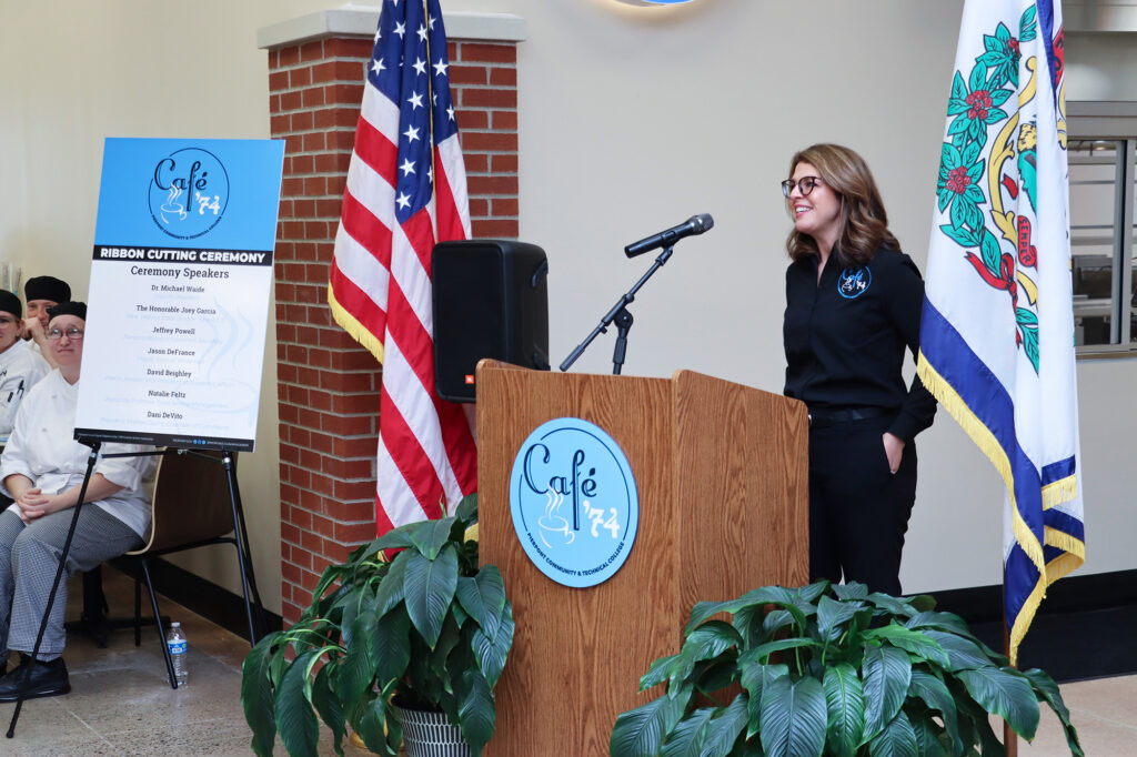 Natalie Feltz, Associate Professor and Program Coordinator for Food Service Management, speaks during the Café ’74 ribbon cutting, highlighting the café as a student‑run operation where experiential, workforce‑driven learning prepares students for real‑world careers.