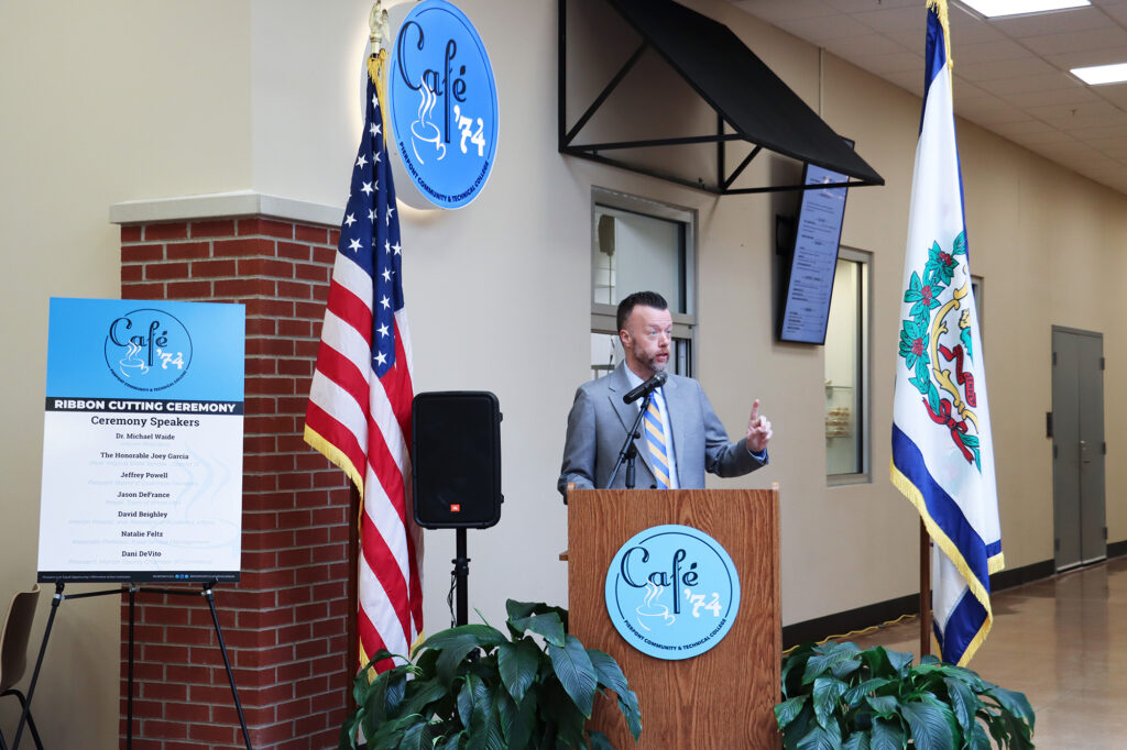 Dr. Michael Waide, Interim President of Pierpont Community & Technical College, speaks at the Café ’74 ribbon cutting, describing the student‑run café as a living example of workforce education where students learn by doing.