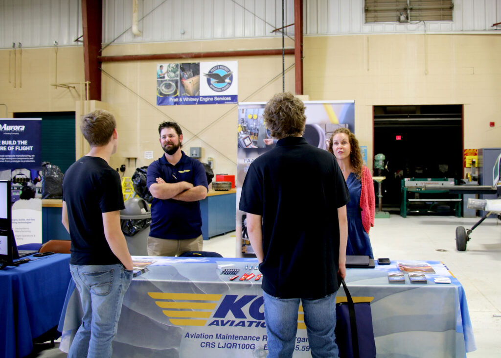 Students speak with representatives from KCI Aviation during Pierpont Community and Technical College’s Aviation Technology Career Fair on Thursday, April 23, 2026, at the Robert C. Byrd National Aerospace Education Center in Bridgeport, W.Va.