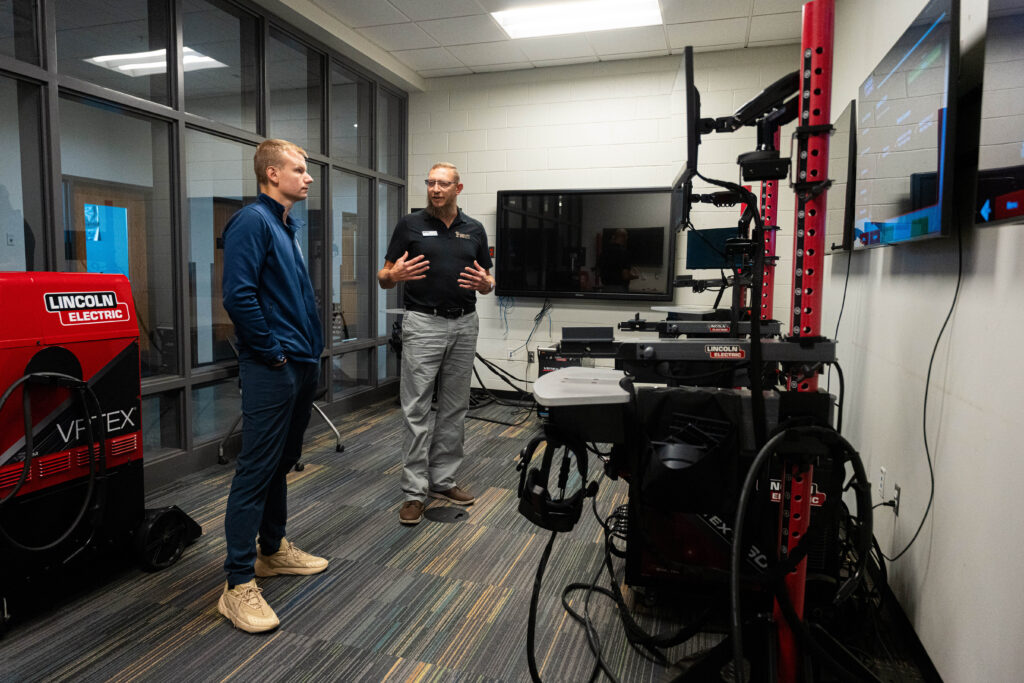 Pierpont Photo. Delegate John Williams participates in a welding simulation at Pierpont Community & Technical College’s Advanced Technology Center during a visit on Tuesday.