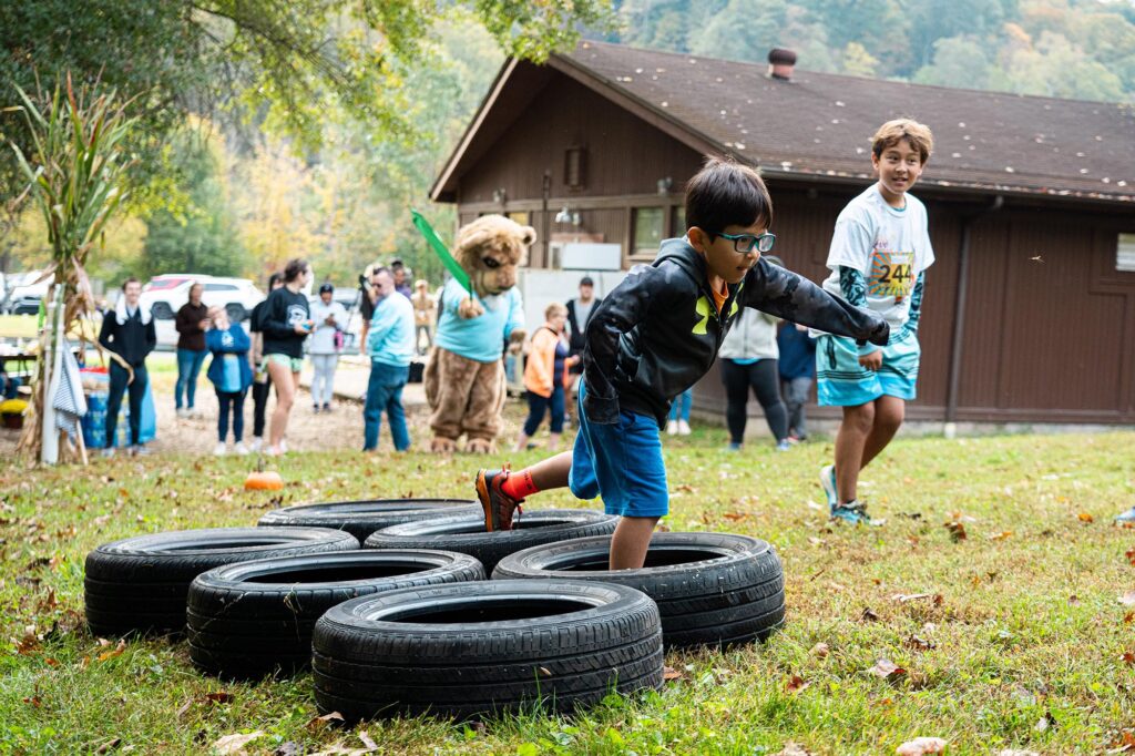 Children navigate obstacles during Monty’s Mini Mile at Pierpont Community & Technical College’s inaugural Fall in Love with Health 5K. The youth race introduced young participants to fitness and healthy living in a fun, family-friendly environment.