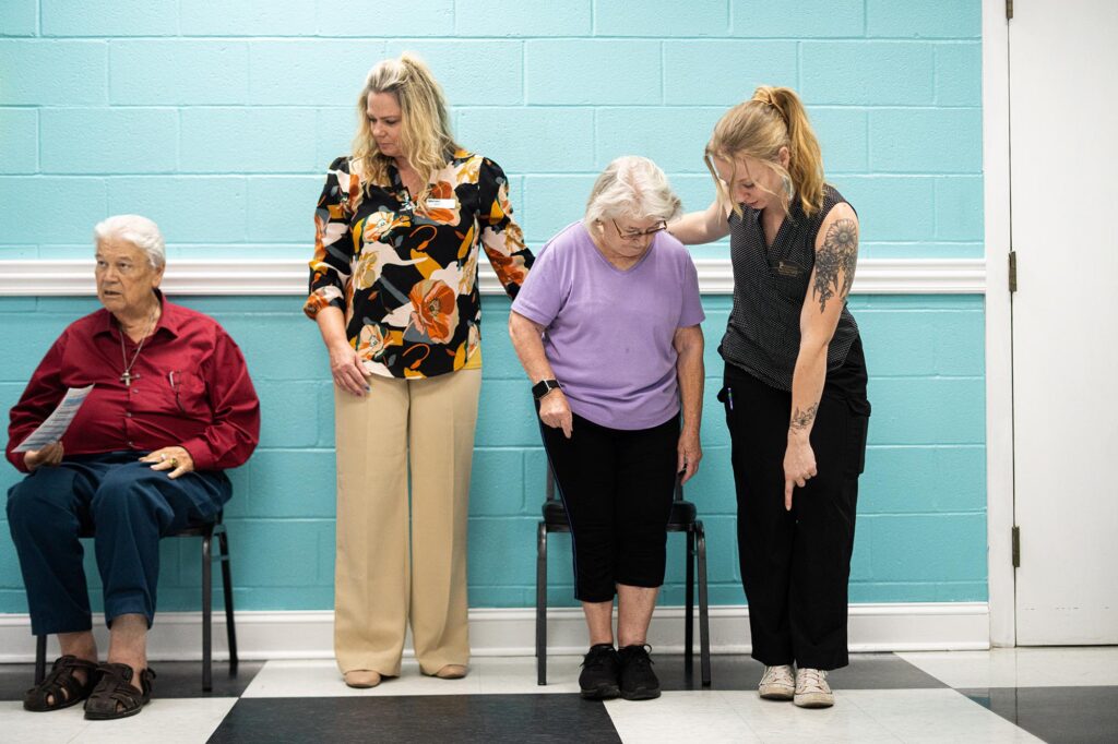 Bryanna Ordiway, Clinical Education Coordinator and Assistant Professor for the Physical Therapist Assistant Program, as well as a student, Kayla Saiz, work with a member of the Harrison County Senior Center. (Pierpont Photo / Benjamin Powell)