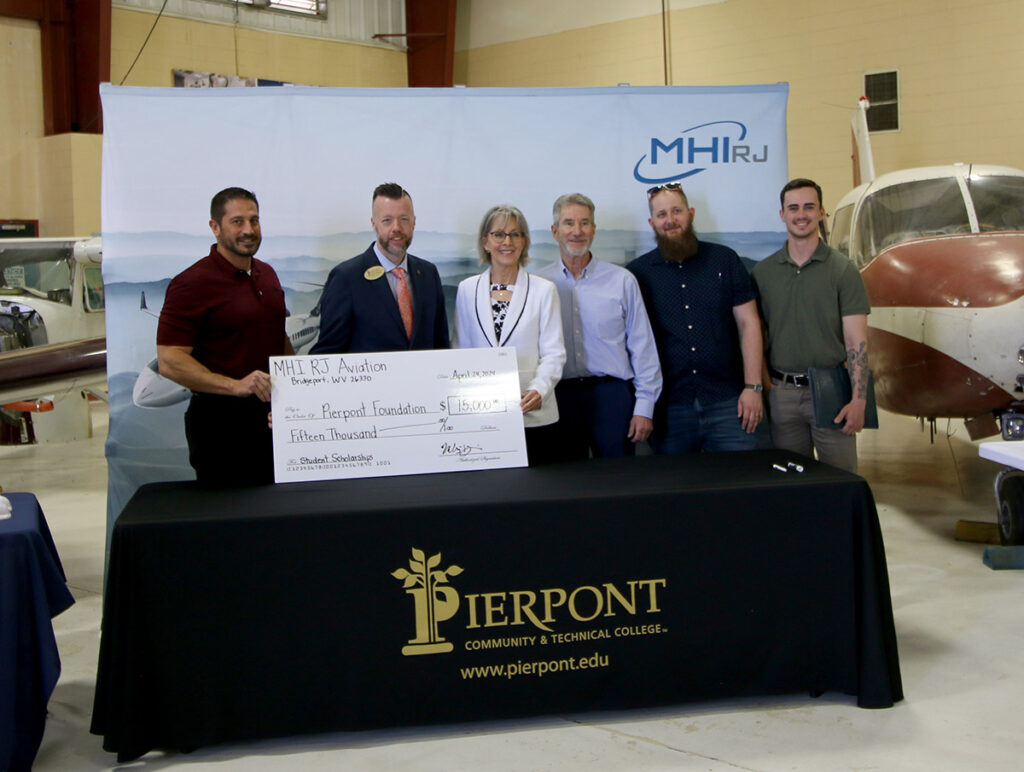MHIRJ donates $15,000 to the Pierpont Community & Technical College’s Aviation Maintenance Program. Pictured, from left, Michael Genin, Director of Operations at MHIRJ; Dr. Michael Waide, Interim President at Pierpont Community & Technical College; Kathy Hypes, Director at the Pierpont Foundation; Dr. Brad Gilbert, Director of Aviation at Pierpont Community & Technical College; and two students within the Aviation Maintenance Technology program, Nathan Keener and Jacob O'hern.