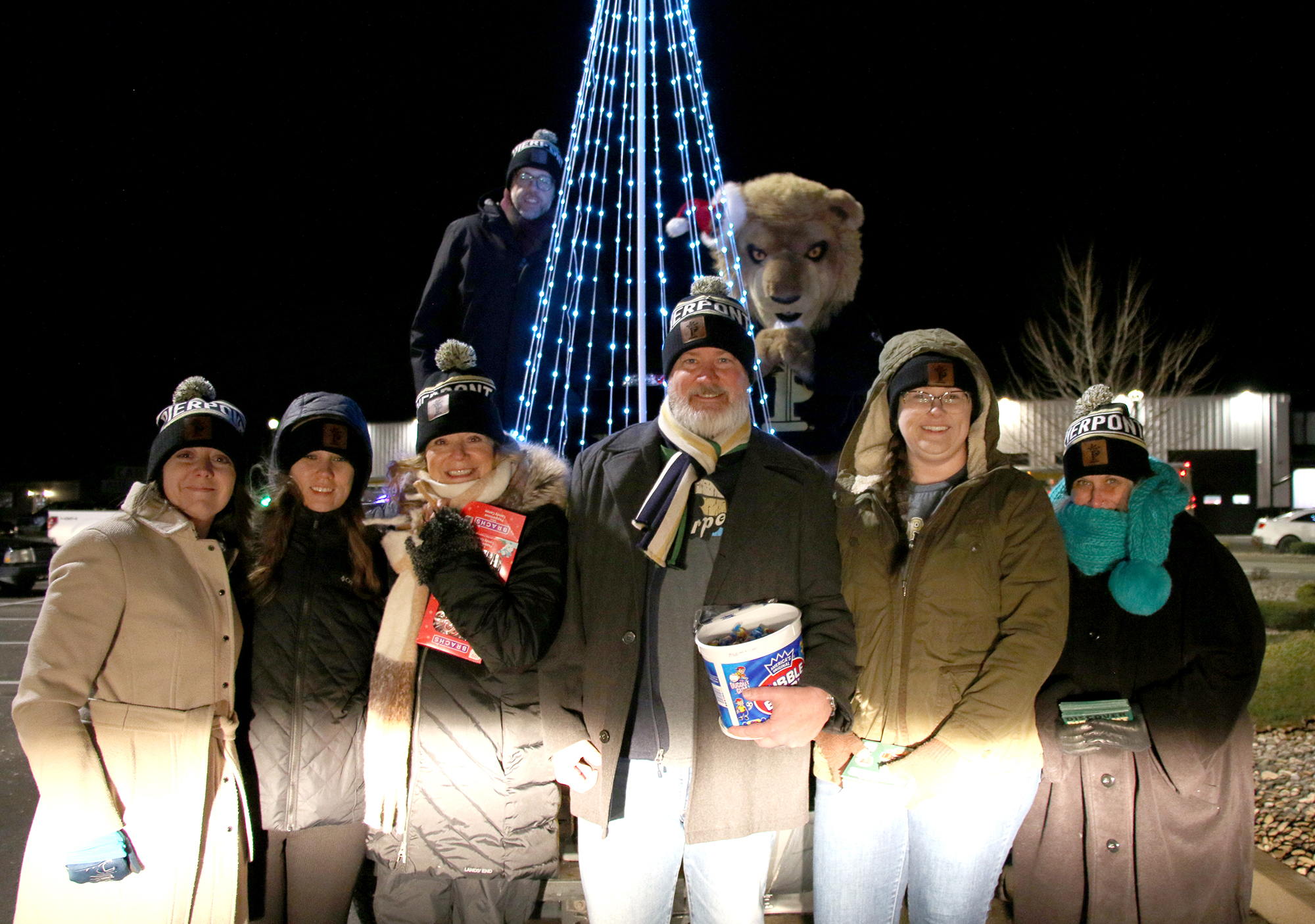 Pierpont Community & Technical College faculty and staff gather during the White Hall Christmas Parade on Dec. 11. The group helped spread holiday cheer by handing out candy and Pierpont sticker sheets along the parade route.