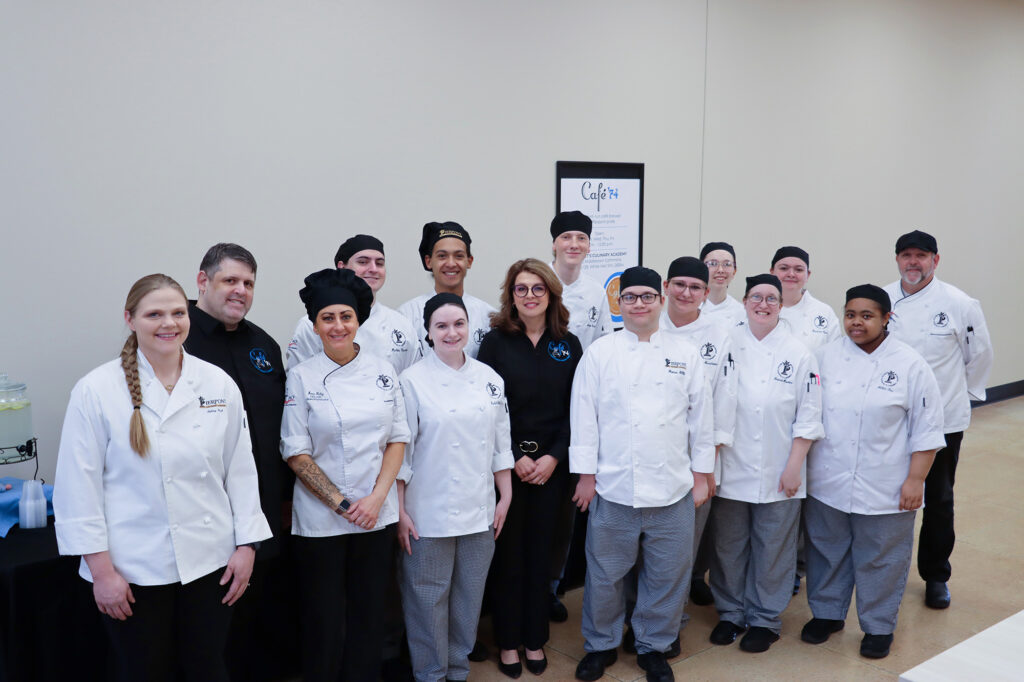 Food Service Management faculty stand with students who operate Café ’74, a student‑run café at Pierpont Community & Technical College.