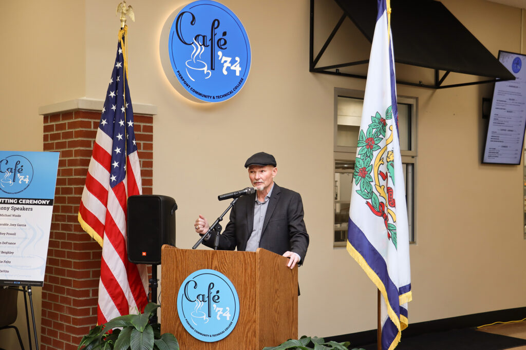 Jeffrey Powell, secretary of the Pierpont Board of Governors, addresses attendees at the Café ’74 ribbon cutting, noting the café’s evolution from an early concept into a learning space that benefits students, the college and the community.
