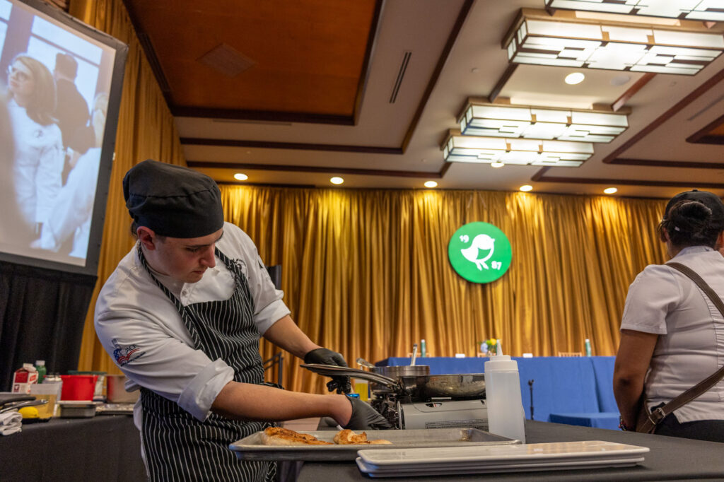 Pierpont Community & Technical College culinary student Matthias Freeman prepares his competition dish during the 3rd Annual WVU Culinary Competition at Nemacolin. Competitors were given 45 minutes to execute their dishes under professional kitchen conditions.
