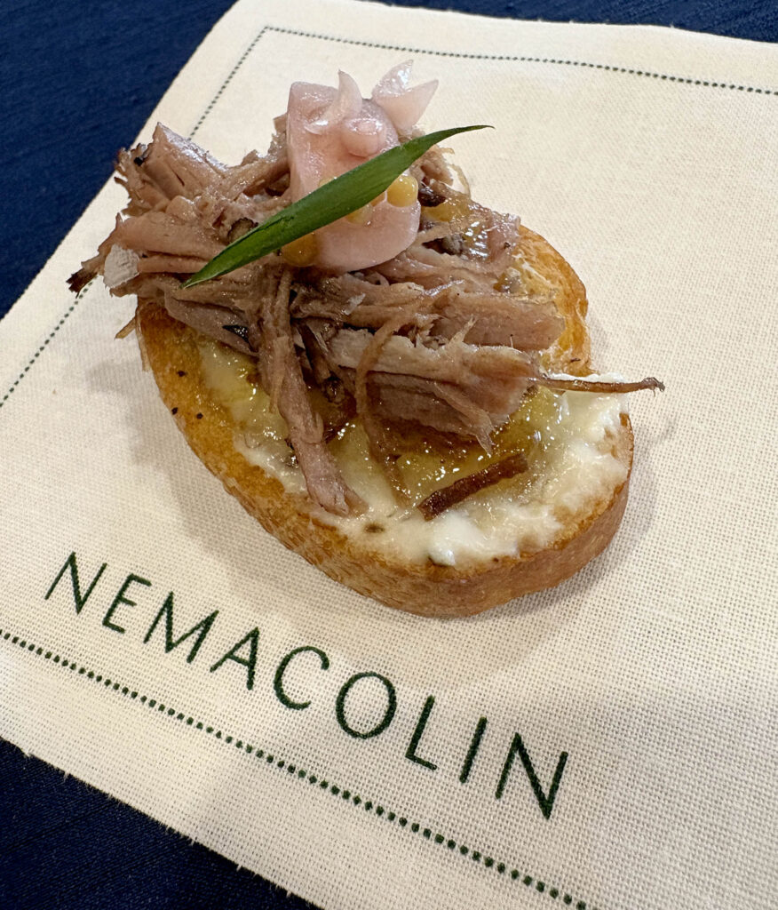 Freeman’s People’s Choice–winning amuse-bouche — a red wine–braised brisket crostini topped with gorgonzola, fig jam, pickled shallots, and mustard seeds — is shown during cocktail-style service at the competition.