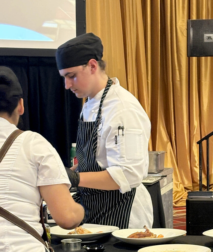 Pierpont student Matthias Freeman prepares his entrée during the 3rd Annual WVU Culinary Competition at Nemacolin, where competitors had 45 minutes to complete their dishes.