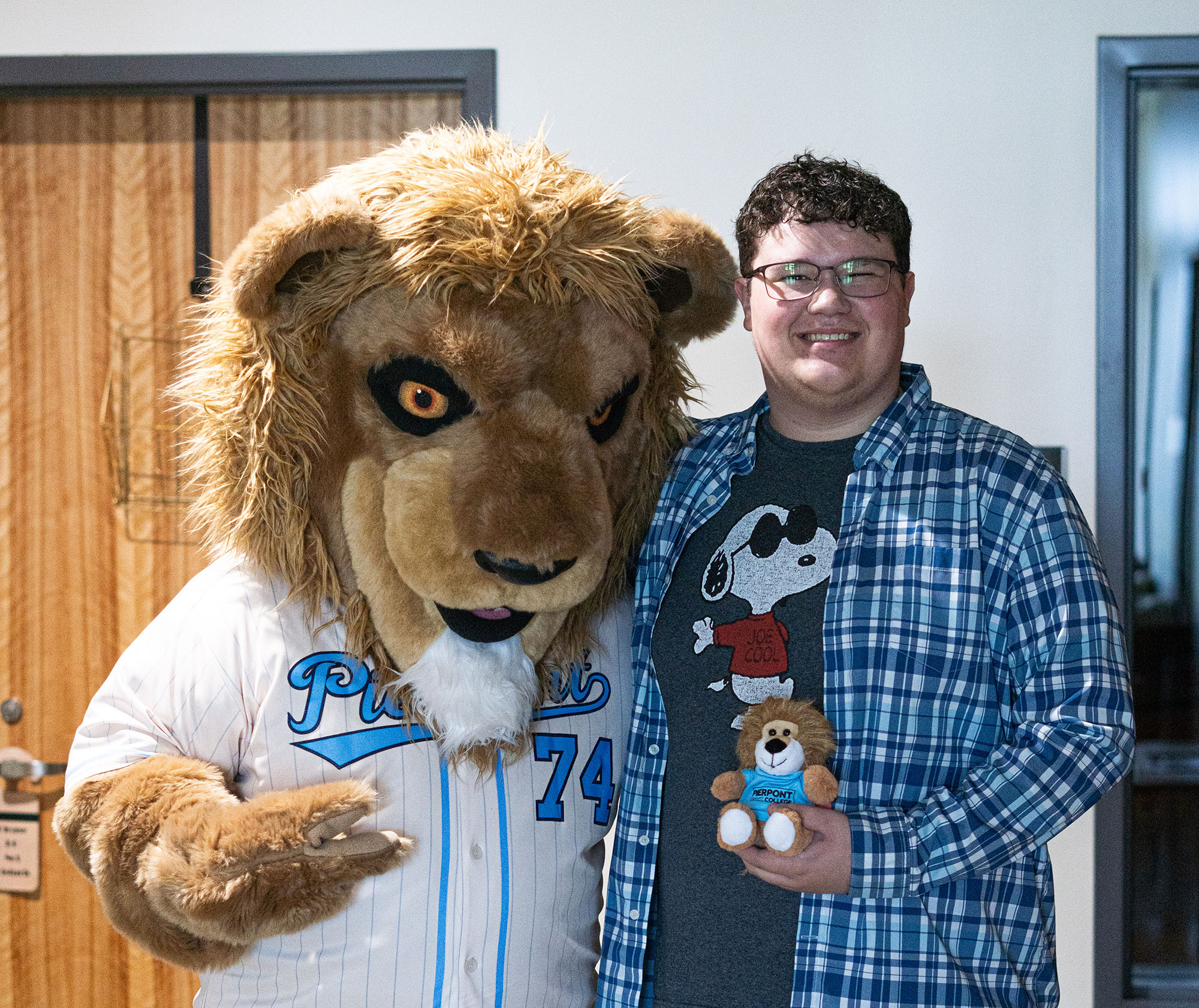 Pierpont Photo. A Pierpont Community & Technical College student poses with Monty the Lion during the first day of the Fall 2026 semester as students returned to campus for a new academic year.