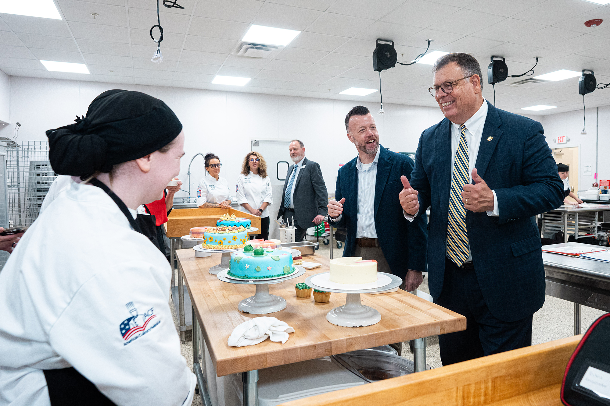West Virginia Sen. Michael A. Oliverio II and Pierpont Community & Technical College President Dr. Michael Waide speak with bakery and pastry students during a tour of Pierpont’s Culinary Academy on Monday.