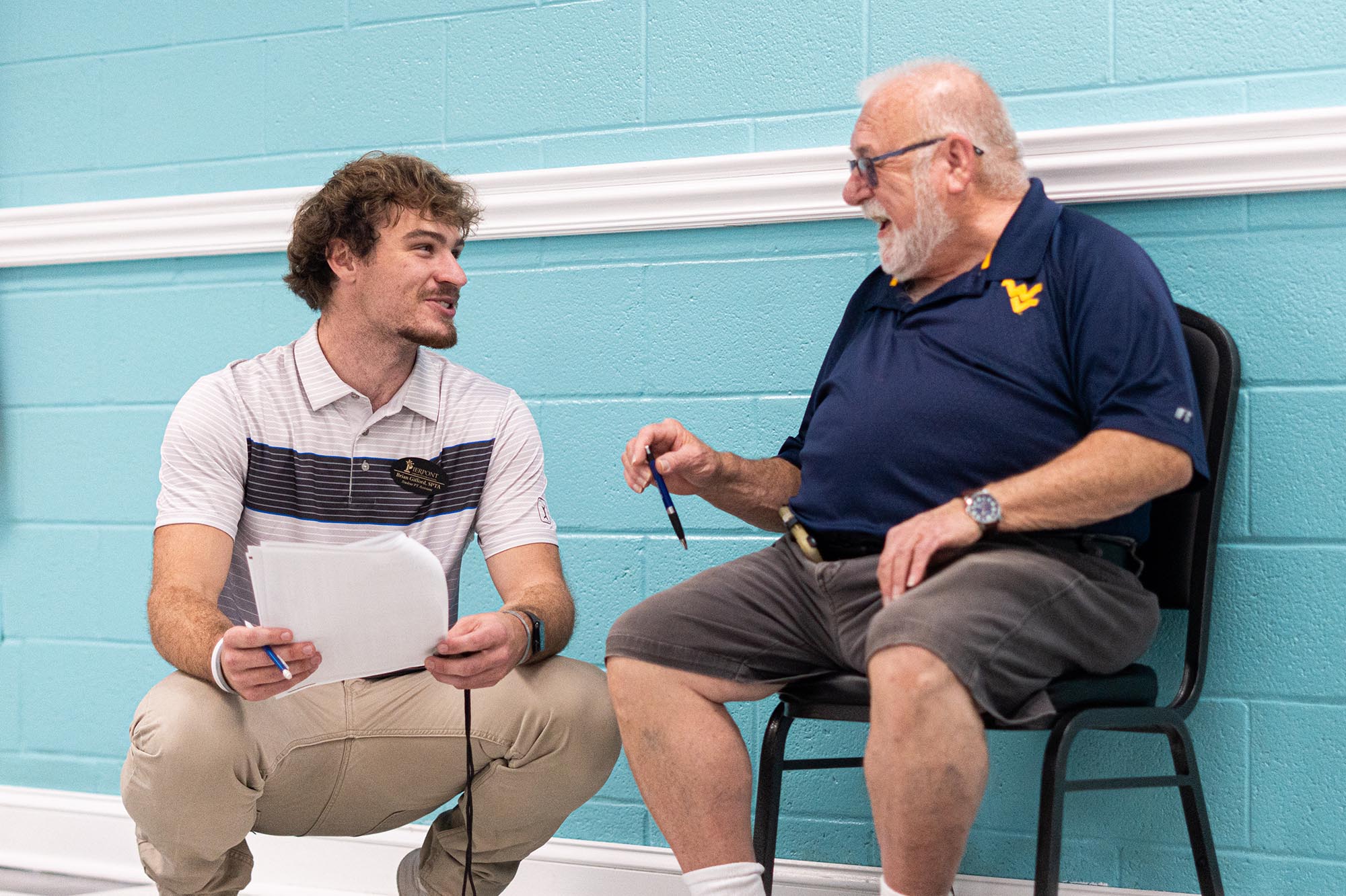 Brian Gifford, a student in the Physical Therapist Assistant Program at Pierpont, works with a member of the Harrison County Senior Center. (Pierpont Photo / Benjamin Powell)